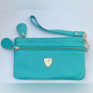 Black Knight Classic Rider Wristlet in turquoise with a gold leather accent.